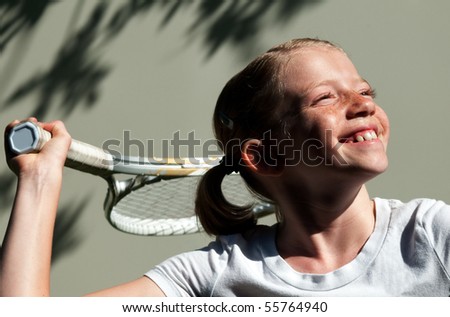 stock photo : Confident Elementary Age Girl on the Tennis Court.