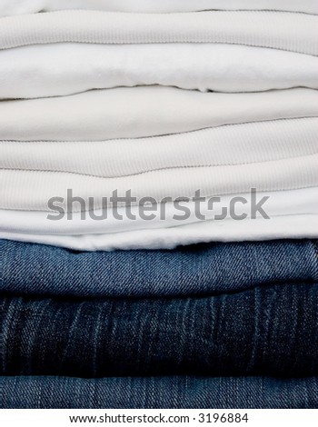 folded stack of white & denim laundry