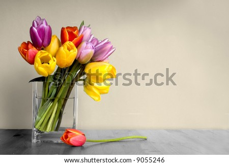 vase of tulips on table