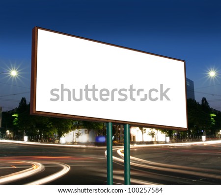 white display advertising with traffic at night