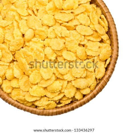 straw plate with corn flakes on a white background, izolated