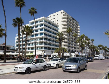 LARNACA, CYPRUS - MARCH 23,2015 : Seafront walkway at Foinikoudes Beach Larnaca on the south coast of the Mediterranean island of Cyprus.