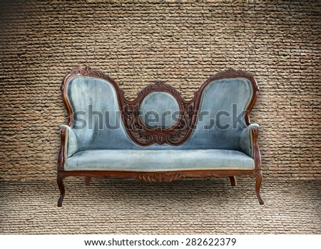 Background of old vintage brick wall and old vintage sofa
