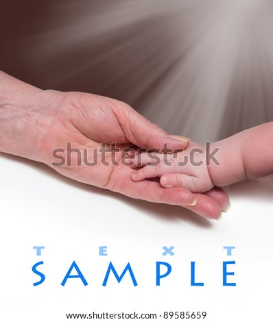 hands of the infant and an elderly man