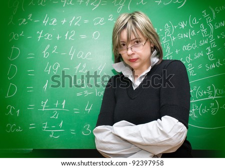 angry teacher with blackboard on the background
