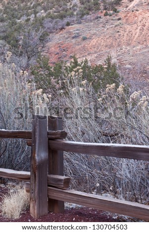 Wooden fence post and tall yellow grasses in Zion\'s National Park