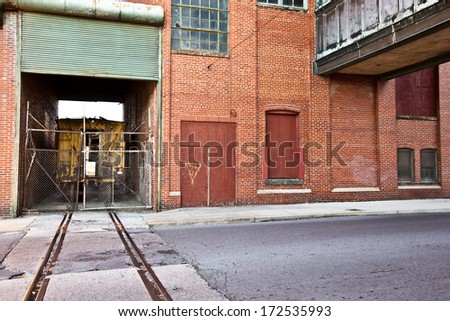 Abandoned World War II factory with train and stop light