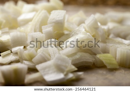 Macro shot of freshly diced onions  on granite counter top