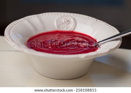 Russian borscht soup bisque with potatoes, leeks, carrots, and beets white and black background