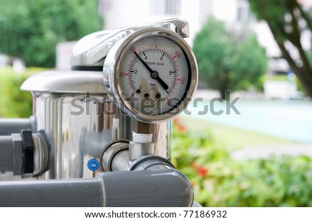 Outdoor residential weather resistance water filter pressure meter.