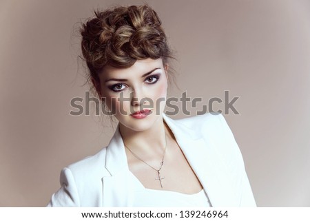 Beautiful woman with bright make-up and hairstyle, work in studio