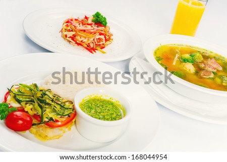 Business lunch on a white background, three dishes