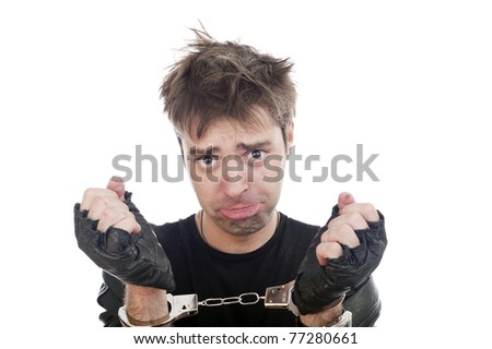 funny crazy young adult maniac guy with handcuffs isolated image, Down\'s syndrome