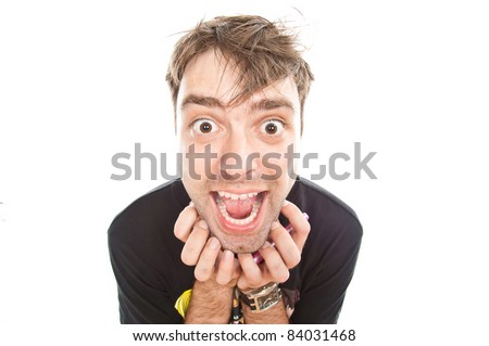 young crazy guy looks into the camera, isolated over white