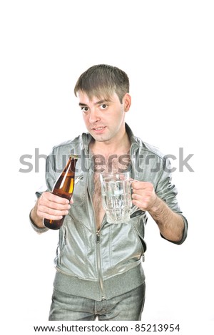young handsome guy pours beer into the cup, isolated over white