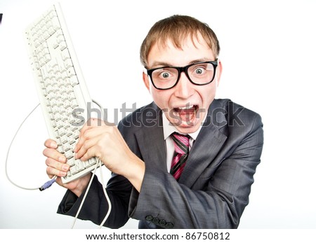 young crazy guy with glasses with a keyboard in hand, isolated over white