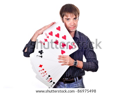 young crazy guy standing with a large playing cards in hand, isolated over white