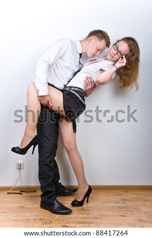 boy and girl having fun in the workplace, isolated over white