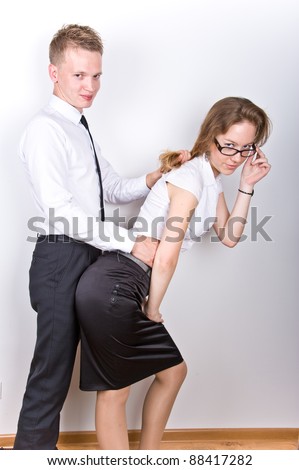 boy and girl having fun in the workplace, isolated over white