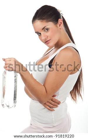young beautiful fitness girl with a bottle of water, the girl in the t-shirt with a bottle of still pure water, the image on a white background