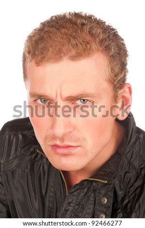 Portrait of attractive Caucasian guy, emotion, suspicion, distrust and wary of angry, isolated on a white background, the emotional face of a man