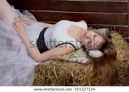 The original wedding - the bride is wearing rubber boots in the hay