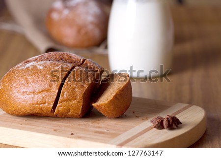 Baking cake and milk on background