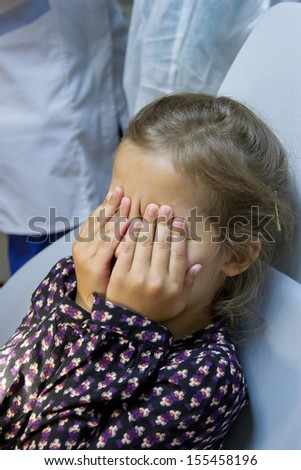 frightened girl at dentist's office
