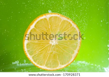 Glass citrus squeezer with lemons and juice