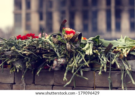 KIEV, UKRAINE, FEBRUARY 27, 2014:  flowers and the lamps in memory of those killed on evromadane in February 2014