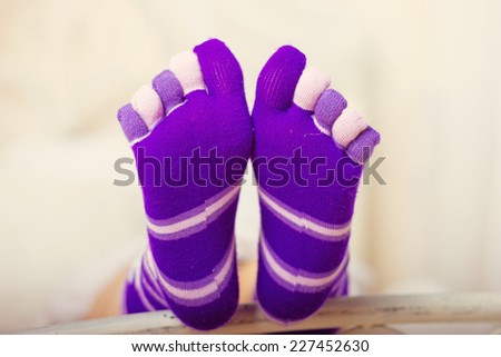 Legs in socks with individual toes