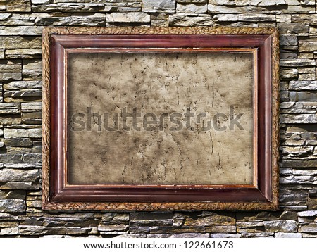 old picture frames with cracked canvas on a brick wall in grunge style