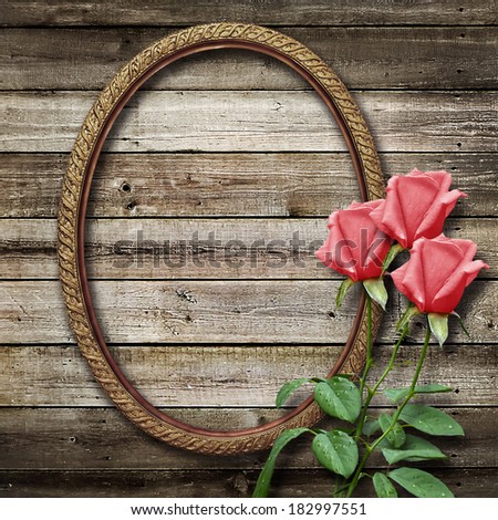 Old vintage frame for photos and a bouquet of yellow roses