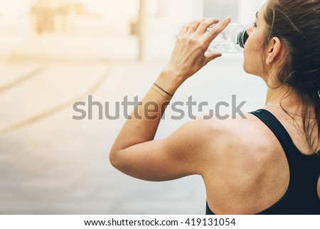Sport woman. Rest.Drink water. Water bottle .Motivation. Sport concept