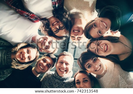 Group of people in circle . Friends looking down  . Concepts about friendship,lifestyle,unity,business and teamwork.