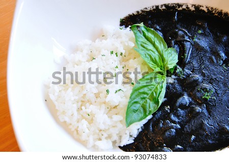rice and ink of squid on white dish