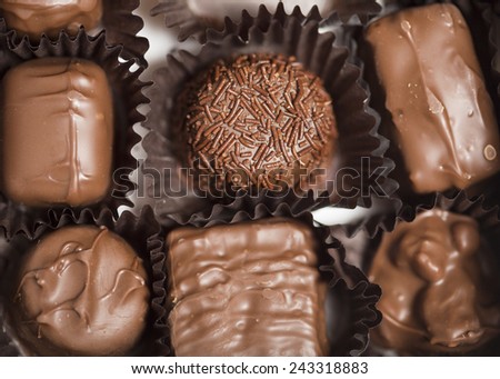 An assortment of delicious chocolate candies in wrappers.