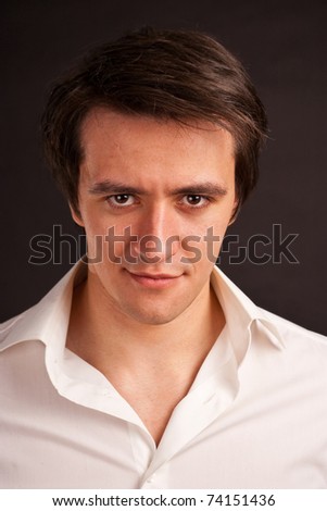 It's Never too Late Stock-photo-adult-guy-in-the-white-shirt-on-a-black-background-74151436