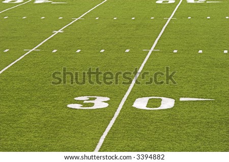 Detail of an American football field - 30 yard line.