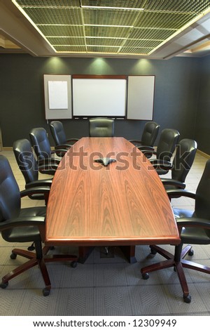 Conference table and blank presentation board.