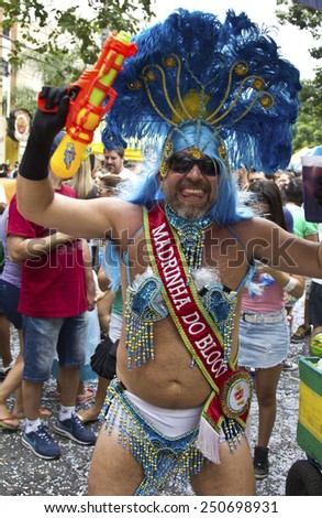 SAO PAULO, BRAZIL - JANUARY 31, 2015: An unidentified man dressed like a woman participate in the annual Brazilian street carnival dancing and singing samba.