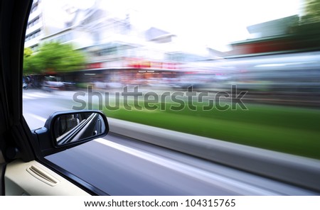 car driving fast in the city
