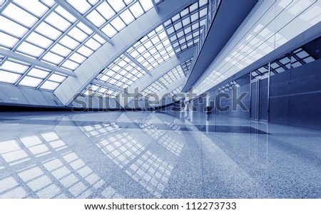 interior of the modern mall of beijin airport subway station.