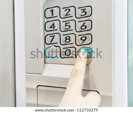 Woman finger pushing button