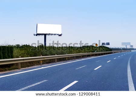 Commercial blank billboard besides the high-way