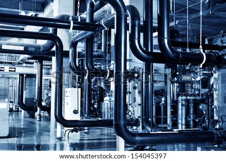 Modern boiler room equipment for heating system. Pipelines, water pump, valves, manometers.