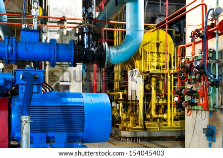 Modern boiler room equipment for heating system. Pipelines, water pump, valves, manometers.
