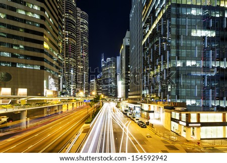 the light trails on the modern building background in Hong Kong China