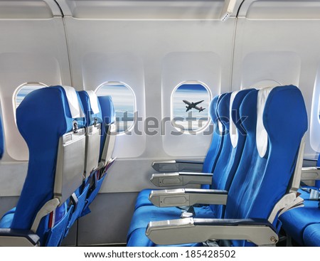 Empty aircraft seats and windows.