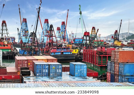 HONG KONG -Aug14: Containers at Hong Kong commercial port on Aug14, 2013 in Hong Kong, China. Hong Kong is one of several hub ports serving more than 240 million tonnes of cargo during the year.